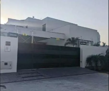 Entrance gate of a modern white villa in DHA Phase 5, Lahore