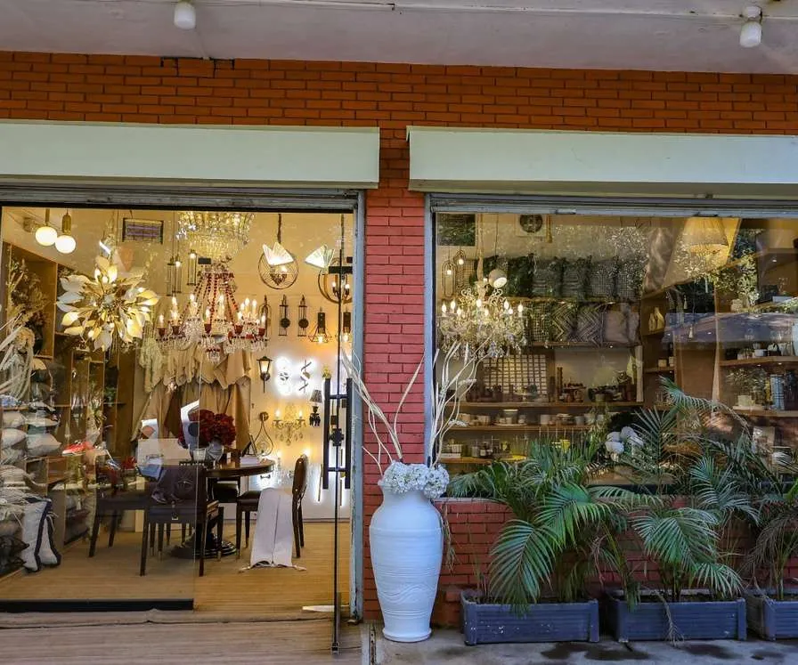 Finished studio storefront with chandeliers and plants, Lahore